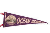 Vintage purple felt flag displaying 'Ocean Beach, N.J.' and sailing boats on waves.