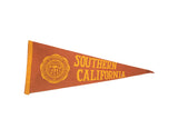 Vintage 1940s-1950s USC felt pennant flag, burnt orange with yellow emblem, 11x27.