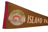 Vintage felt pennant close-up: printed Casino building graphic with red curtains and pink binding.