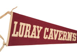 Maroon felt flag with ivory capital 'LURAY' lettering and left binding ties.