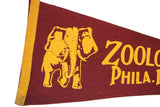 Yellow printed elephant walking left on vintage maroon felt flag.