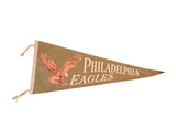 Vintage 1940s-1950s Philadelphia Eagles felt pennant, olive green with red eagle and ivory text.