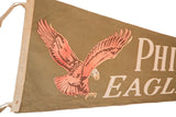 Upper left corner of vintage Philadelphia Eagles felt flag; red eagle, ivory letters, tan binding.