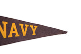 Vintage felt pennant's tapered tip with yellow 'NAVY' lettering.