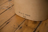 Vintage beige canvas mannequin bust with 'Model 1960 40' text and faint spots.