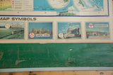 Map symbols and textured green backing of a vintage Rand McNally USA pull down map.