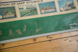 Worn green edge and map symbols on the vintage Rand McNally USA pull down map.