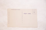 Reverse side of a vintage postcard showing publisher and seller information.