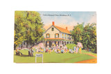 Vintage Cole's Pleasant View postcard showing a colorful house, green lawn, and tourists.