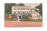 Vintage postcard of the Central House hotel in Palenville, NY, with its green shutters and yellow lawn umbrellas.
