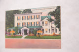 Vintage Central House postcard with its colorful printed image, shown at an angle.