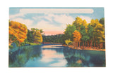 Vintage Catskills postcard of a serene lake reflecting trees with vibrant autumn foliage.
