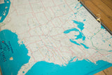 Vintage 1960s Hearne Brothers USA map, teal water, red state lines, metal bracket, and yellow tape.