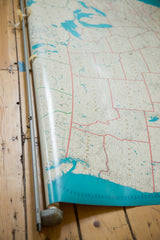 Bottom edge of vintage USA pull down map with partial splitting from metal rod.