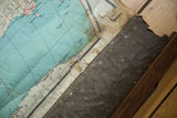 Antique map's extensively damaged, discolored bottom edge and dried canvas backing.