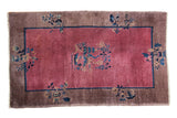 Vintage Chinese Art Deco rug, plum red field, central grape tree motif, gray border.