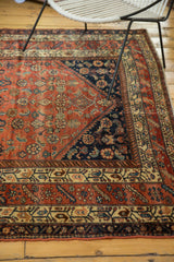 Antique Fine Malayer rug's corner: terra cotta herati field, indigo spandrel, detailed borders.