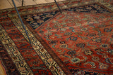 Antique Malayer rug's refined weave, showcasing Herati motif in rich terra cotta and indigo borders.