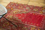 Cherry red mehrab, hook and latch motif, and floral cross-section border on vintage Mudjur rug.