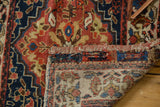 Detailed view of an antique bag face corner revealing the hand-knotted foundation and colorful pile.