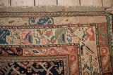 Kurdish rug corner detail with intact macrame fringe, blush and terracotta borders, unique pictorial motifs.
