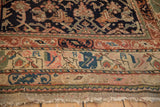 Vintage Kurdish rug border showing hand-knotted animal motifs in blush, indigo, and terracotta.