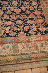 Vintage Kurdish rug borders and field section in indigo, blush, terracotta, and pale green.