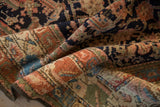 Dense hand-knotted pile and secured edge of a vintage Kurdish rug, featuring colorful motifs.