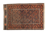 Antique Belouch rug with dark field, terra cotta geometric border and patterns, 3'1