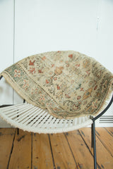 Vintage Oushak rug's worn texture, muted floral pattern, and visible exposed foundation.