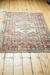 Tattered edges and even wear revealing foundation on the vintage Anatolian rug.