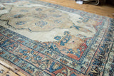 Antique Persian Kerman rug corner with delicate floral vines, blue and cochineal borders.