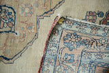 Antique Kerman rug foundation and flipped corner, blue and red floral vines, tattered side.