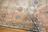 Vintage Lilihan rug border detail with blush, sky blue, and chocolate brown vinery.