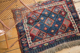 Hand knotted antique Jaff Kurd rug featuring geometric lattice design and vibrant gem tones.