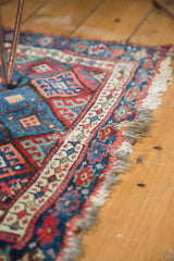 Hand knotted antique Jaff Kurd rug border, showcasing geometric lattice and rich gem tones.