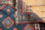 Antique Jaff Kurd rug corner showing hand-knotted foundation, fringe, and vibrant gem-tone patterns.