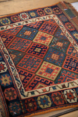 Angled view of the gem-toned lattice pattern on an antique Jaff Kurd bag face.