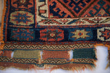 Hand-woven kilim end of an antique Jaff Kurd bag face, detailing colorful panels and authentic, storied wear.