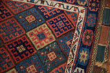Reinforced side cord selvage next to the rich, geometric wool pile of a Kurdish bag face.