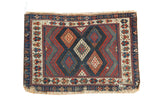 Unusual Antique Jaff Kurd bag face rug featuring lattice diamonds and zig-zag borders.