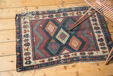 Antique Jaff Kurd with geometric lattice diamond panels, zig-zag borders, madder red, indigo, ivory.