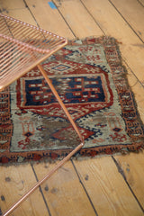 Antique Anatolian rug corner, displaying hard tatter, wear, and geometric cobalt blue and red.