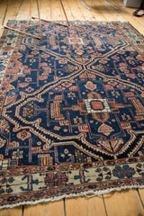 Tattered fringe and ivory, indigo, terra cotta border of an antique Malayer rug.