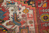 Intricate hand-knotted geometric patterns with floral and stylized animal motifs.