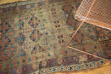 Distressed lower border of a late 19th century Kurdish rug, showing unique leaf motifs.