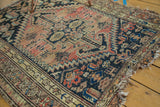Hard tatter and intricate Mir Boteh border design of an antique Malayer rug.