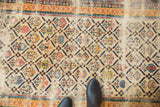 Antique Shirvan rug's Marsali lattice, with vivid colors and visible foundation.
