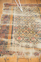 Tattered antique Shirvan rug fragment, showing Marsali lattice, extensive holes, and exposed foundation.