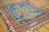 Antique Caucasian rug bottom corner, Mir Serbend border, wave motif, and visible foundation.